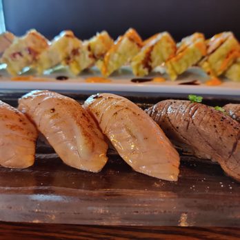 Ho Sushi Bistro - Seared salmon + Seared tuna (front) and Jumbo Cali roll (back) - Sushi Bars Near Me - Everett, Washington Ho Sushi Bistro - Seared salmon + Seared tuna (front) and Jumbo Cali roll (back) - Sushi Bars Near Me - Everett, Washington