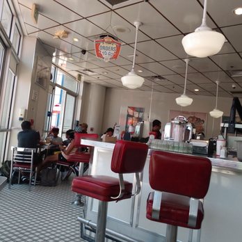 Johnny Rockets - a diner with red chairs and a checkered floor - Diners Near Me - Anaheim, California