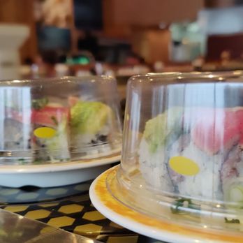 Sushi Hana - a row of plates with sushi on them - Sushi Bars Near Me - Tigard, Oregon Sushi Hana - a row of plates with sushi on them - Sushi Bars Near Me - Tigard, Oregon