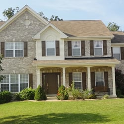 CertaPro Painters of St. Charles, South County & West County - The masonry on this house provides the backdrop for the trim and siding on an extended gabled dormer.
