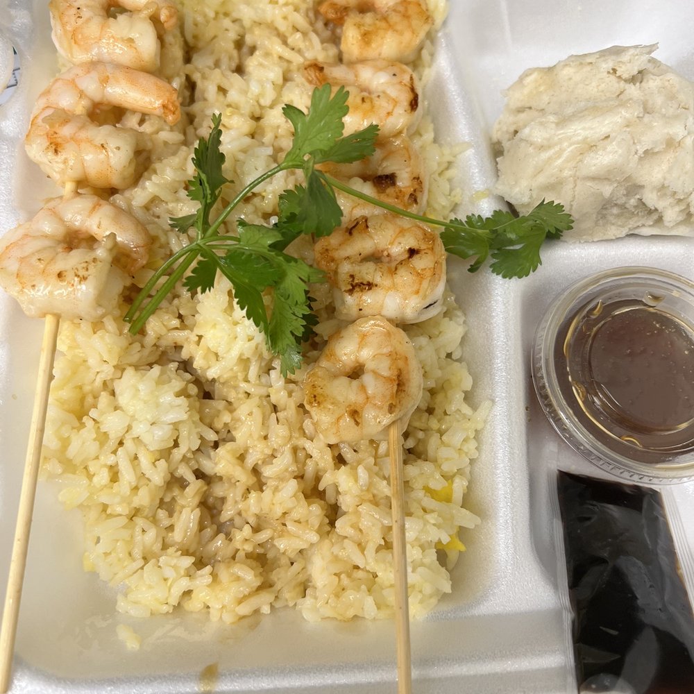 Shrimp and rice with a Bao bun in the side