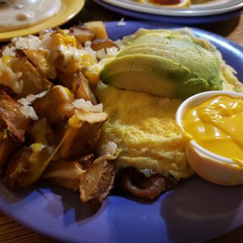 Squeeze In - Racy Tracy Omelette. Under that blanket of egg lovin' is a monster amount of mushroom and bacon. - Breakfast & Brunch Near Me - Reno, Nevada Squeeze In - Racy Tracy Omelette. Under that blanket of egg lovin' is a monster amount of mushroom and bacon. - Breakfast & Brunch Near Me - Reno, Nevada