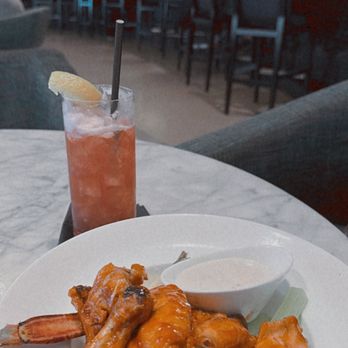 Eliot's Bar - a plate of wings and a drink - Coffee & Tea Near Me - Cleveland, Ohio
