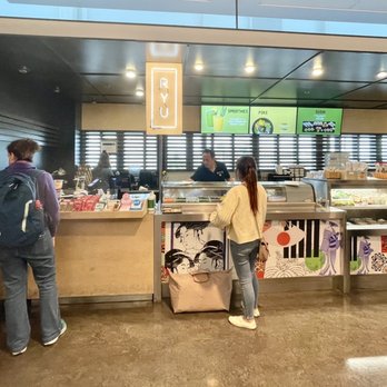 Ryú - a group of people standing in line at a food counter - Japanese Near Me - Dorval, Quebec Ryú - a group of people standing in line at a food counter - Japanese Near Me - Dorval, Quebec