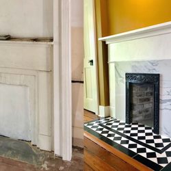 Charlie Angell - The House Doctor - It's amazing what treasures are still hidden in buildings in downtown Savannah, like the original metal plate on this fireplace.