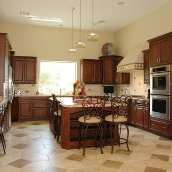 Dream Construction - a large kitchen with a center island - General Contractors Near Me