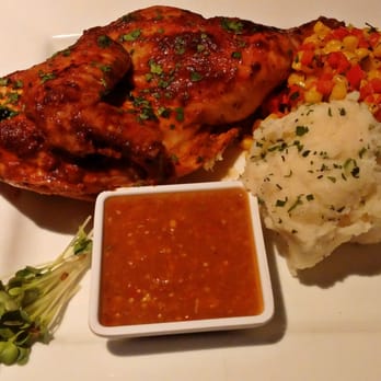 Santa Fe Capitol Grill - Red chile roasted chicken with garlic mashed potatoes, whiskey creamed corn, and tomatillo salsa - Burgers Near Me - Santa Fe, New Mexico Santa Fe Capitol Grill - Red chile roasted chicken with garlic mashed potatoes, whiskey creamed corn, and tomatillo salsa - Burgers Near Me - Santa Fe, New Mexico
