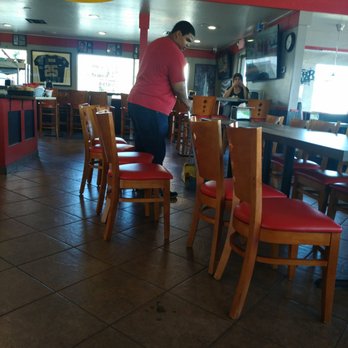 Jack's Pizza and Bar - Employee sweeping while mngr sits and eats. She's wearing flip flops, no shoes and socks. - Pizza Near Me - Manteca, California Jack's Pizza and Bar - Employee sweeping while mngr sits and eats. She's wearing flip flops, no shoes and socks. - Pizza Near Me - Manteca, California