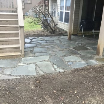 Clay Creek Landscaping - Stone patio under deck of end unit townhouse. - Landscaping Near Me Clay Creek Landscaping - Stone patio under deck of end unit townhouse. - Landscaping Near Me