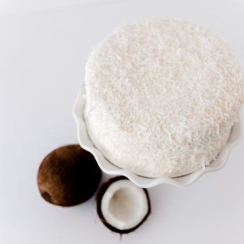 Sugartopia Bakery - a coconut cake on a white plate - Cupcakes Near Me - Oakwood, Georgia