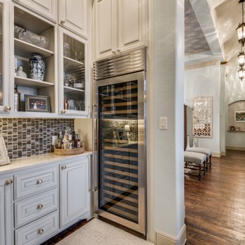 Renfrow Dunaway Group - a kitchen with a wine cooler - General Contractors Near Me Renfrow Dunaway Group - a kitchen with a wine cooler - General Contractors Near Me