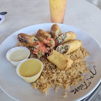 Mi Pueblo Mexican Grill - Crispy rolls over seasoned rice with fresh pico and dipping sauces, paired with a refreshing citrus drink. Flavorful and satisfying! - Mexican Near Me - Concord, North Carolina