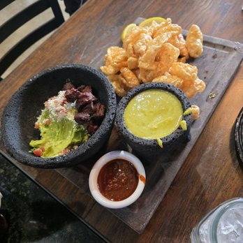 Compadres Cantina - Chicharrones with guac molcajete. - Mexican Near Me - Ontario, California