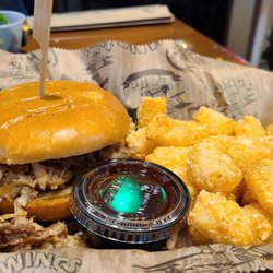 Wings Etc - Pulled Pork Sandwich w/barbecue sauce and tarter tots.