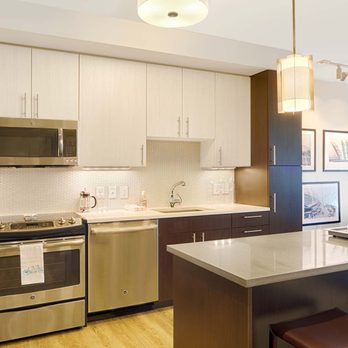 One Canal - Brand-new kitchens feature stainless steel appliances, two-tone modern cabinets and quartz countertops - Apartments Near Me - Boston, Massachusetts One Canal - Brand-new kitchens feature stainless steel appliances, two-tone modern cabinets and quartz countertops - Apartments Near Me - Boston, Massachusetts