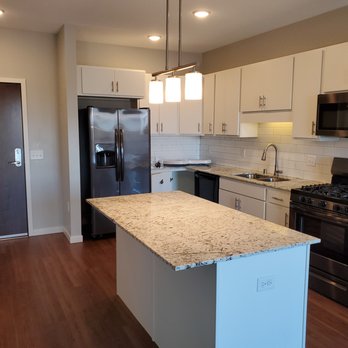 The Heights 55 Plus - Kitchens have white cabinets with grey or white granite. We also have dark cabinets with white granite. - Apartments Near Me - Mendota Heights, Minnesota The Heights 55 Plus - Kitchens have white cabinets with grey or white granite. We also have dark cabinets with white granite. - Apartments Near Me - Mendota Heights, Minnesota