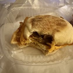Breakfast sandwich with bacon, sausage and egg