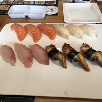 Sushi Taku - Mixed Nigiri - Salmon (top right) White Tuna (top left) Yellowtale (bottom right) Eel (bottom right) - Japanese Near Me - Chicago, Illinois Sushi Taku - Mixed Nigiri - Salmon (top right) White Tuna (top left) Yellowtale (bottom right) Eel (bottom right) - Japanese Near Me - Chicago, Illinois