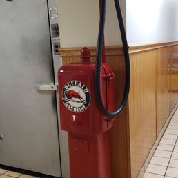 a red gas pump in a restaurant