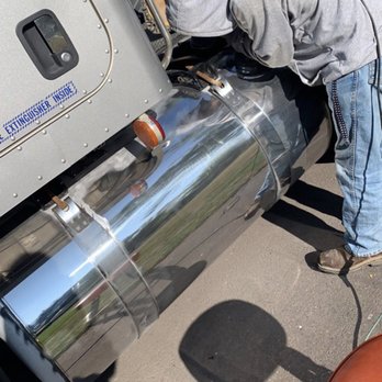 DRCS Auto/boat Detailing - Staff sanding a aluminum tank for polishing - Auto Detailing Near Me DRCS Auto/boat Detailing - Staff sanding a aluminum tank for polishing - Auto Detailing Near Me