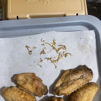 Wingstop - Feathers pulled out of the oily under-seasoned lemon pepper wings. - Chicken Wings Near Me - Slidell, Louisiana