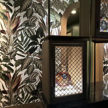 Caló Kitchen + Tequila - Very cool wallpaper with bar cages in front - Cocktail Bars Near Me - Costa Mesa, California