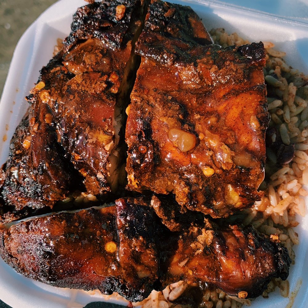 ribs and rice in a styrofoam container ribs and rice in a styrofoam container