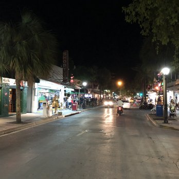 Duval Street - Duvall Street lit up at night - Local Flavor Near Me - Key West, Florida