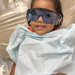 West Coast Dental & Orthodontics - My son, sitting in a chair, getting ready for his checkup and cleaning. They let him use the glasses.