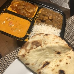 a plate of food with rice, meat, and curry a plate of food with rice, meat, and curry