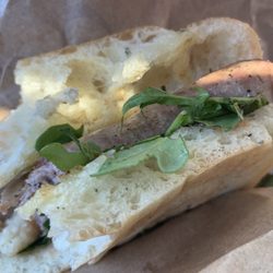 Cioffi's Cucina - Mild Italian sausage with arugula on a freshly baked ciabatta bun.