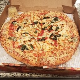 Large pizza with chicken and spinach. Large pizza with chicken and spinach.