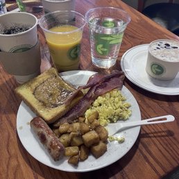 Breakfast buffet: eggs, sausage, bacon, potatoes, French toast, oatmeal, OJ, water, coffee. Breakfast buffet: eggs, sausage, bacon, potatoes, French toast, oatmeal, OJ, water, coffee.