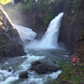 Franklin Falls Trailhead - Frozen rock with person on last bit of trail - Hiking Near Me - North Bend, Washington