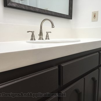 Designs and Applications - a sink and mirror in a bathroom - General Contractors Near Me - Huntington Beach, California Designs and Applications - a sink and mirror in a bathroom - General Contractors Near Me - Huntington Beach, California