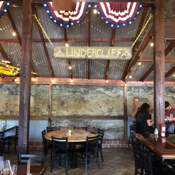Undercliff Grill & Bar - Interior, part of exposed cliff on far wall - American Near Me - Joplin, Missouri Undercliff Grill & Bar - Interior, part of exposed cliff on far wall - American Near Me - Joplin, Missouri