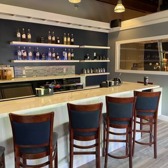 Sailbird Distilling - a bar with chairs - Distilleries Near Me - St. Augustine, Florida