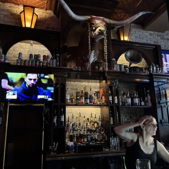Speakeasy - a woman sitting at a bar - Speakeasies Near Me - Austin, Texas Speakeasy - a woman sitting at a bar - Speakeasies Near Me - Austin, Texas