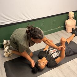 Realistic hands on emergency response practice during our CPR instructor course at INCHES Safety Solutions.