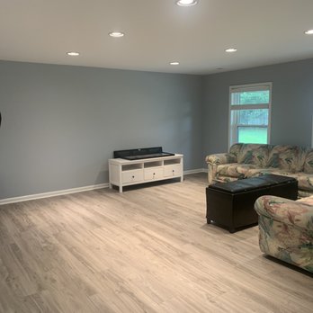City Painters - Main Room - After (Light Blue Walls, Vinyl Wood Flooring, White Trim) - Painters Near Me City Painters - Main Room - After (Light Blue Walls, Vinyl Wood Flooring, White Trim) - Painters Near Me