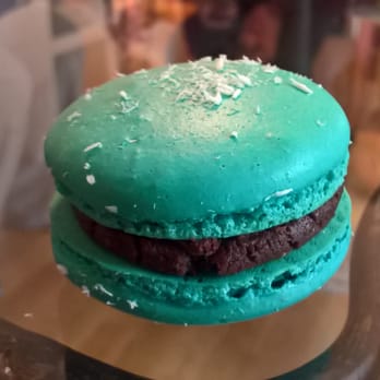 Cook With Muriel - a blue macaron on a glass table - Cooking Classes Near Me - Tampa, Florida Cook With Muriel - a blue macaron on a glass table - Cooking Classes Near Me - Tampa, Florida