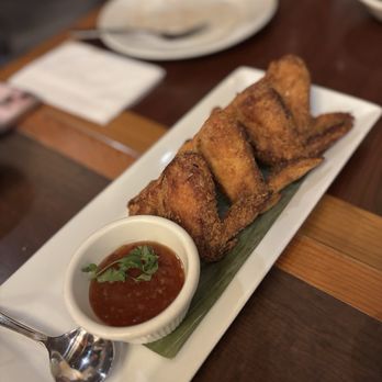 Patsara Thai Restaurant - GARLIC WINGS Thai style marination and battered with garlic. Served with Thai Chili sauce - Thai Near Me - New Westminster, British Columbia Patsara Thai Restaurant - GARLIC WINGS Thai style marination and battered with garlic. Served with Thai Chili sauce - Thai Near Me - New Westminster, British Columbia