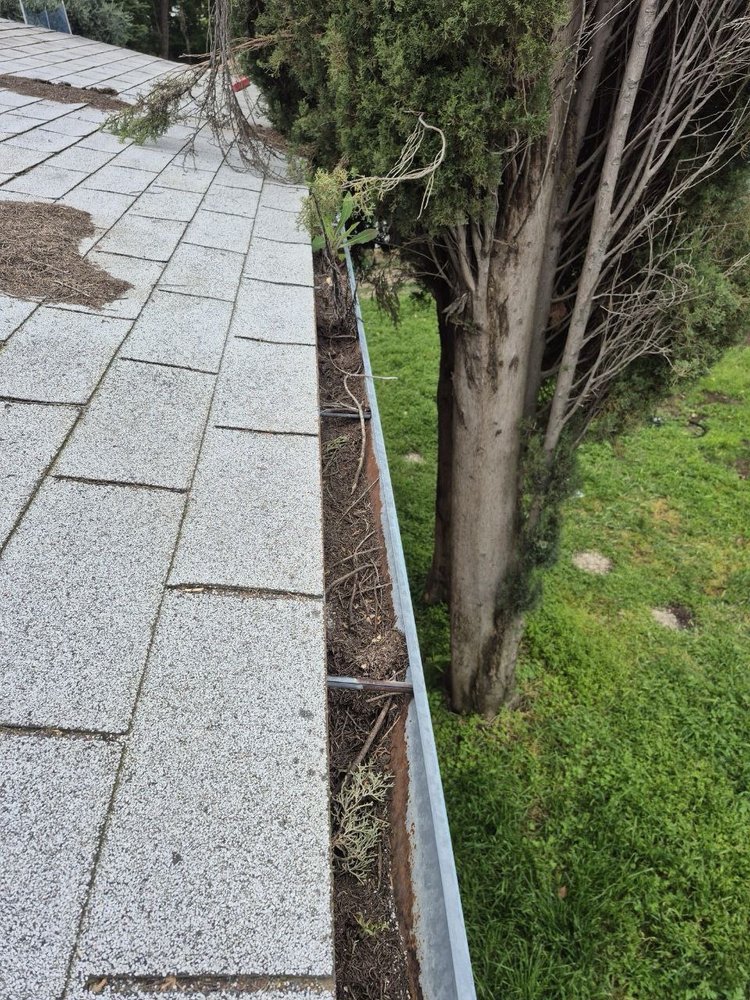 Slide of Cleaning Gutters Service