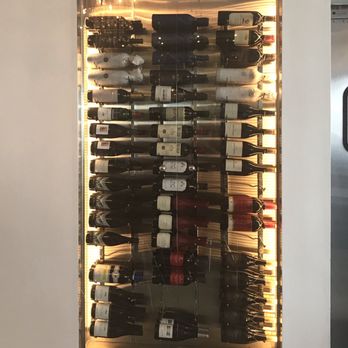 Angel's Share Craft Cocktail Bar - a wall of wine bottles - Cocktail Bars Near Me - Monterey, California Angel's Share Craft Cocktail Bar - a wall of wine bottles - Cocktail Bars Near Me - Monterey, California