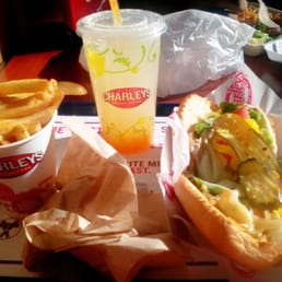Veggie sub, fries, and peach lemonade.