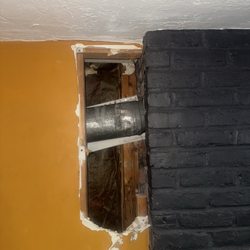 Danny's Masonry - The beautiful hole they left behind big enough for a small creature to climb down and through.
