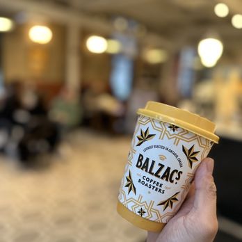 Balzac's Coffee Roasters - a hand holding a cup of coffee - Coffee Roasteries Near Me - Toronto, Ontario Balzac's Coffee Roasters - a hand holding a cup of coffee - Coffee Roasteries Near Me - Toronto, Ontario