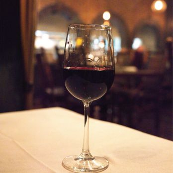 Le Moo - a glass of wine on a table - Steakhouses Near Me - Louisville, Kentucky Le Moo - a glass of wine on a table - Steakhouses Near Me - Louisville, Kentucky