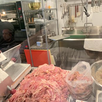 Sanguich - Yummy ham being carved - Cuban Near Me - Miami, Florida Sanguich - Yummy ham being carved - Cuban Near Me - Miami, Florida