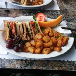 Restaurant L'eggsoeufs - " Half of my Club Sandwich, served with fruits & potatoes "